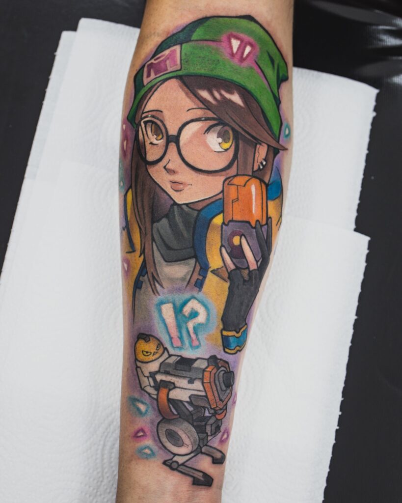 Colorful anime character tattoo on forearm featuring detailed design elements.
